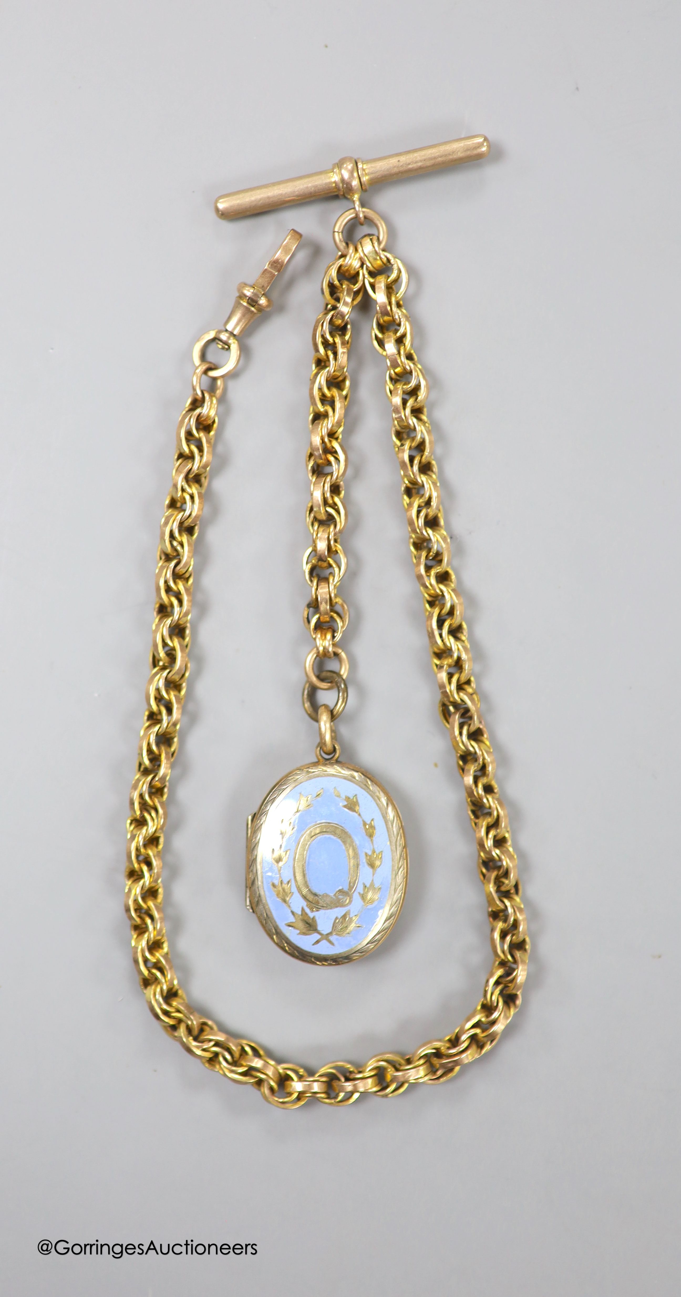 A Victorian gilt metal and enamel oval locket, 29mm, together with a fancy double link albert, stamped 9c, 34.5cm, 25 grams.